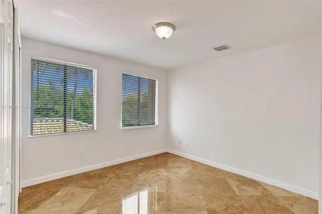 a living room with furniture a dining table and chairs