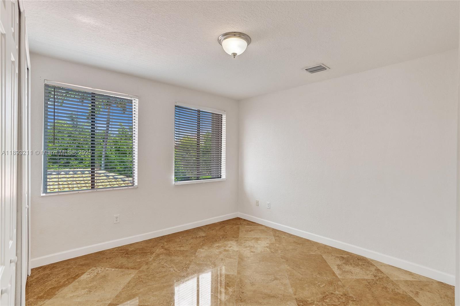 7722 Southwest 188th Terrace Cutler Bay, FL 33157 - Photo 45 of 89 a view of empty room with window