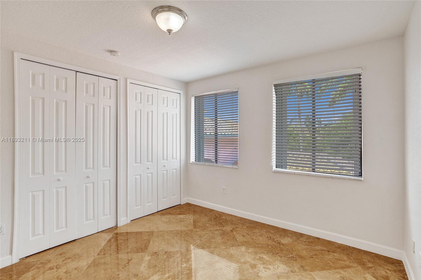 7722 Southwest 188th Terrace Cutler Bay, FL 33157 - Photo 48 of 89 a view of an empty room with a window