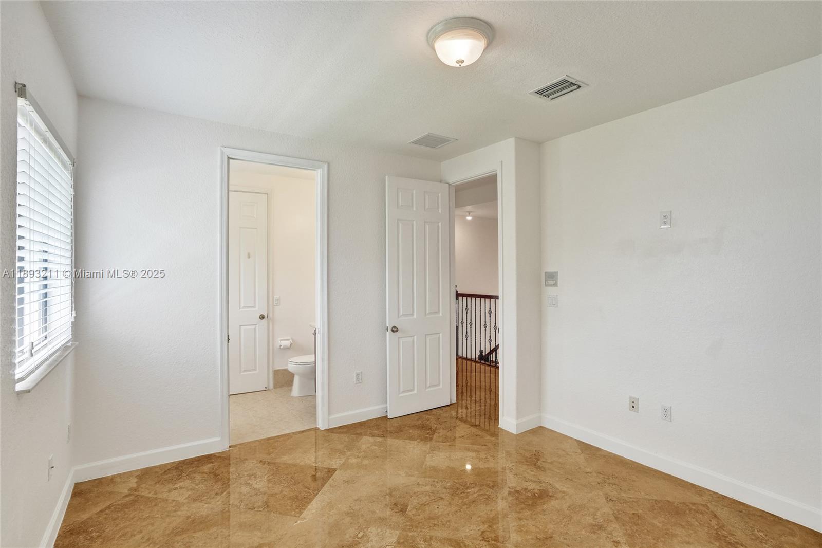 7722 Southwest 188th Terrace Cutler Bay, FL 33157 - Photo 52 of 89 an empty room with windows and closet