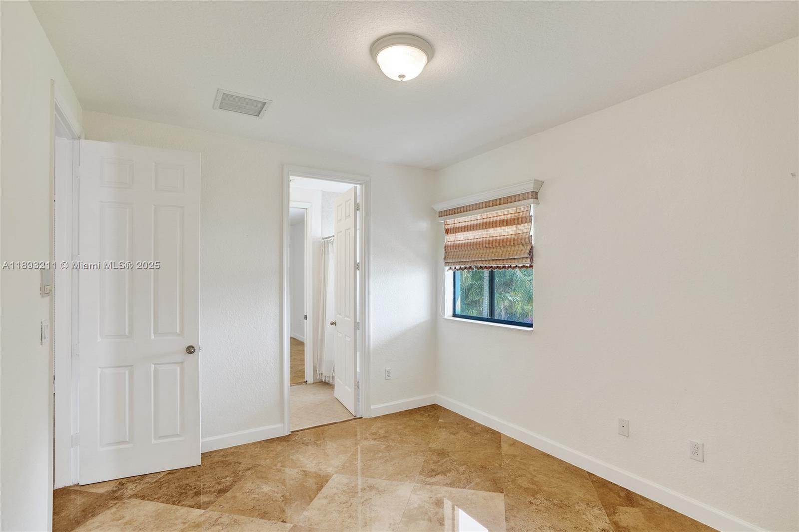 7722 Southwest 188th Terrace Cutler Bay, FL 33157 - Photo 58 of 89 an empty room with windows and closet