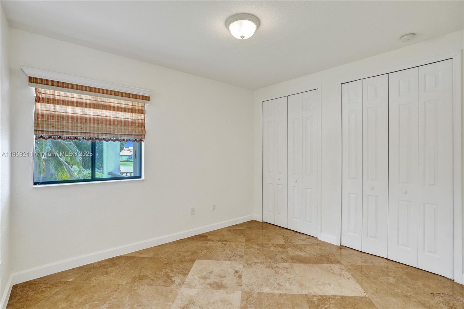 7722 Southwest 188th Terrace Cutler Bay, FL 33157 - Photo 59 of 89 a view of an empty room with a window