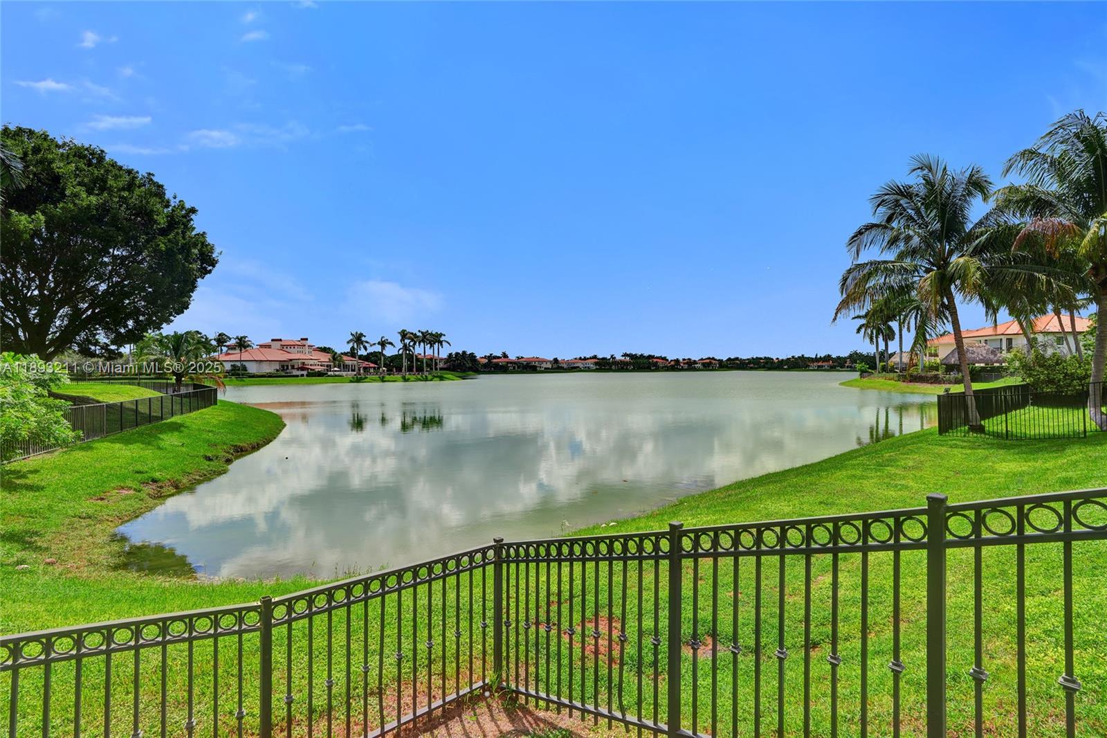 7722 Southwest 188th Terrace Cutler Bay, FL 33157 - Photo 62 of 89 a view of a lake with a big yard