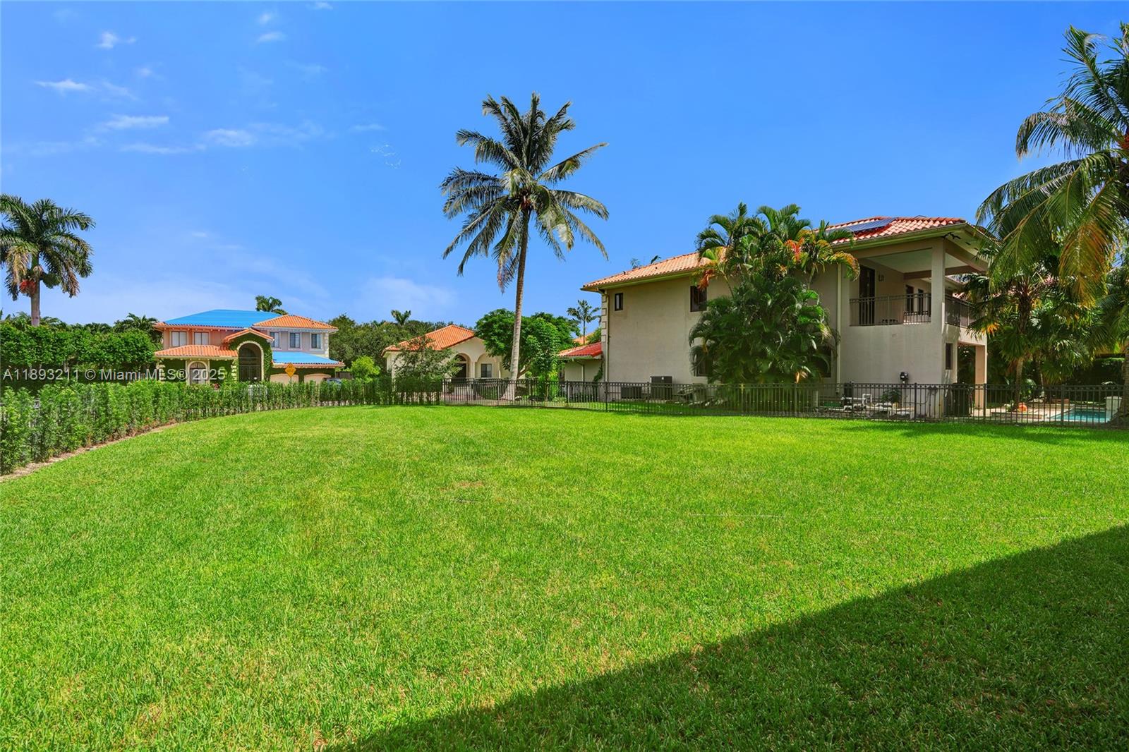 7722 Southwest 188th Terrace Cutler Bay, FL 33157 - Photo 66 of 89 a front view of house with garden and trees