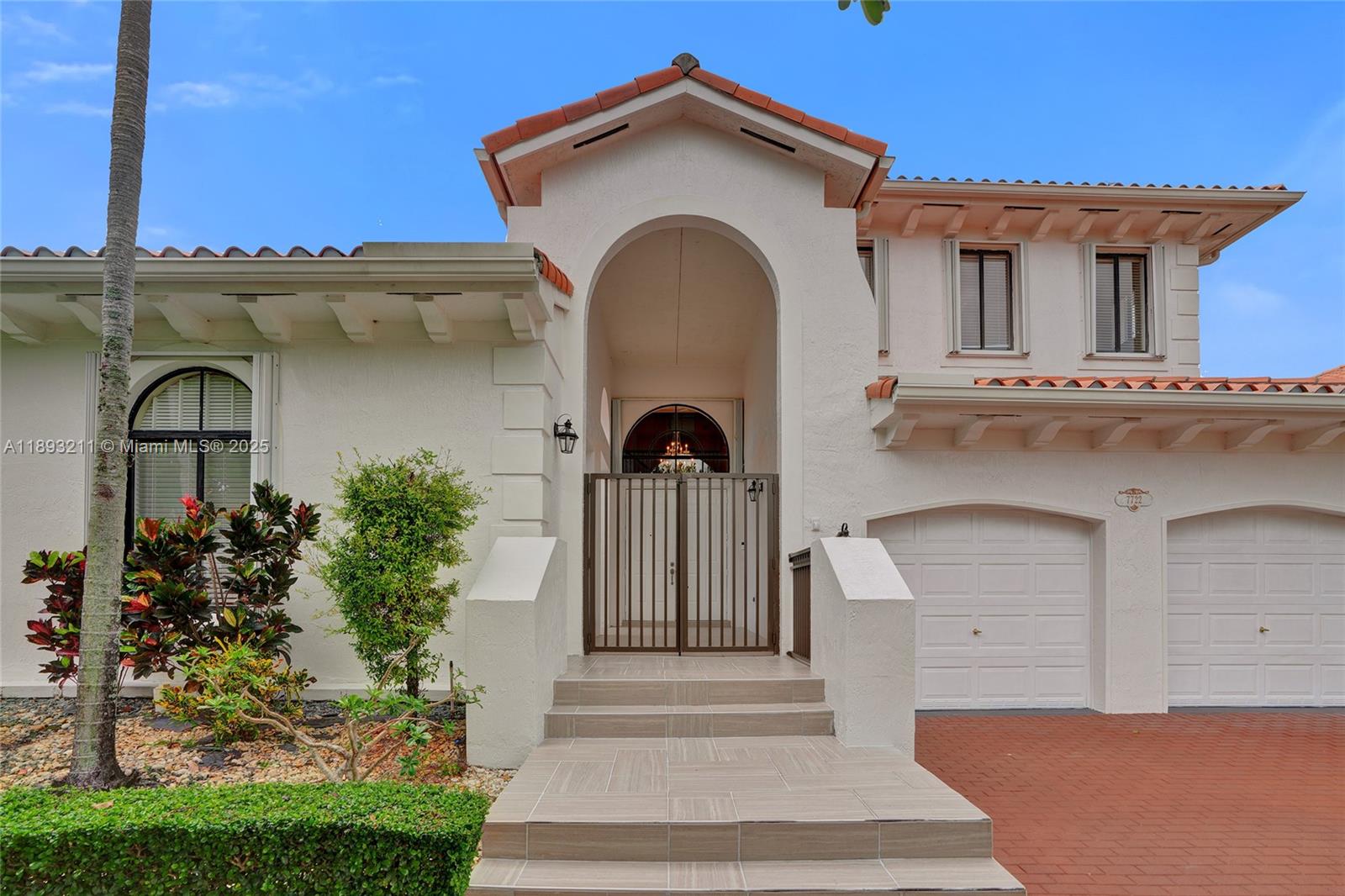 7722 Southwest 188th Terrace Cutler Bay, FL 33157 - Photo 84 of 89 a front view of a house with a garden