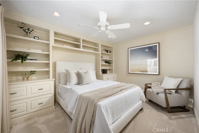 an outdoor sitting area with couch and a potted plant