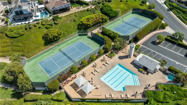 a view of swimming pool with chairs