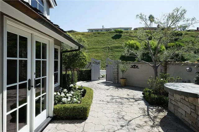 a view of a porch with potted plants