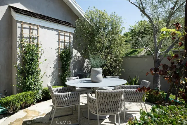 a view of a patio filled with furniture