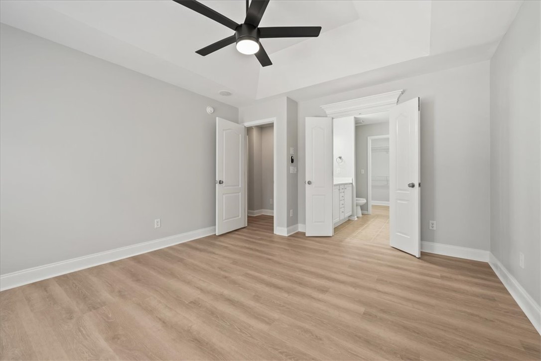 100 Shipyard Circle Anderson, SC 29621 - Photo 19 of 40 This spacious bedroom offers comfortable living with elegant flooring and a well-appointed private bath.