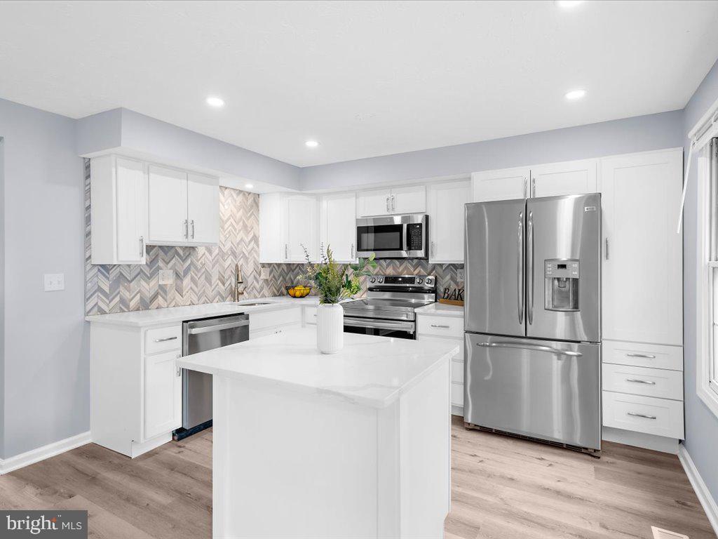 15 Ramsgate Court Halethorpe, MD 21227 - Photo 14 of 48 Kitchen island designed for meal prep and dining