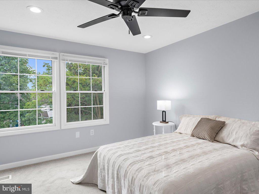 15 Ramsgate Court Halethorpe, MD 21227 - Photo 22 of 48 Primary bedroom with ceiling fan and new carpet