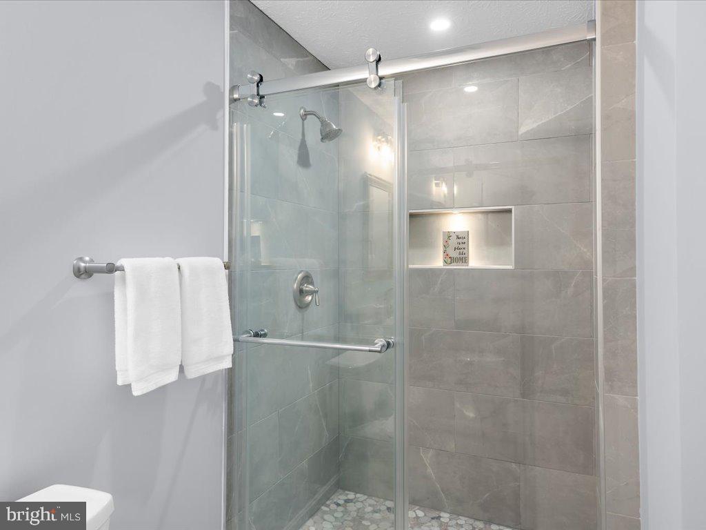 15 Ramsgate Court Halethorpe, MD 21227 - Photo 28 of 48 Tiled shower with barn style door & lighted niche