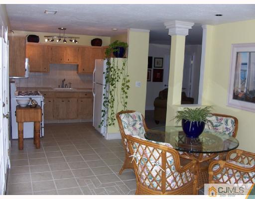 40 Sturgis Road Edison, NJ 08817 - Photo 4 of 10 a bathroom with a granite countertop sink a mirror and shower