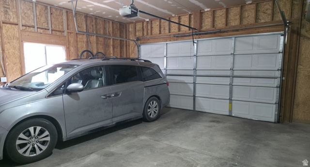 1437 925 South Vernal, UT 84078 - Photo 34 of 47 Attached two-car garage featuring a white panel door and an automatic opener