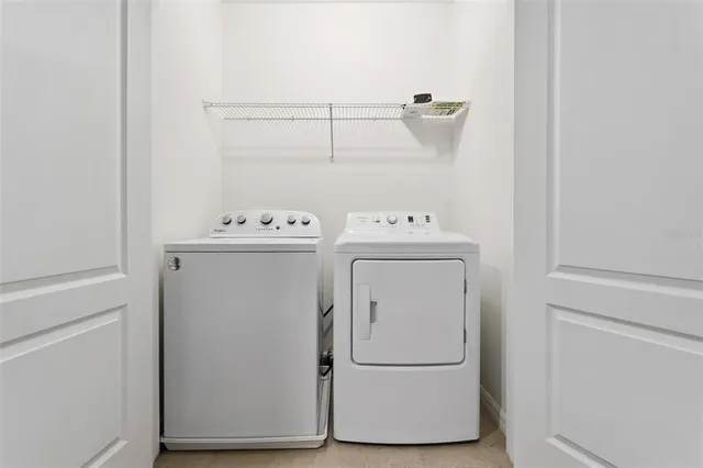 a utility room with dryer and washer