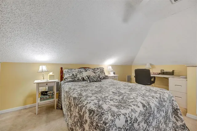 a view of a dining room with furniture a fireplace and wooden floor