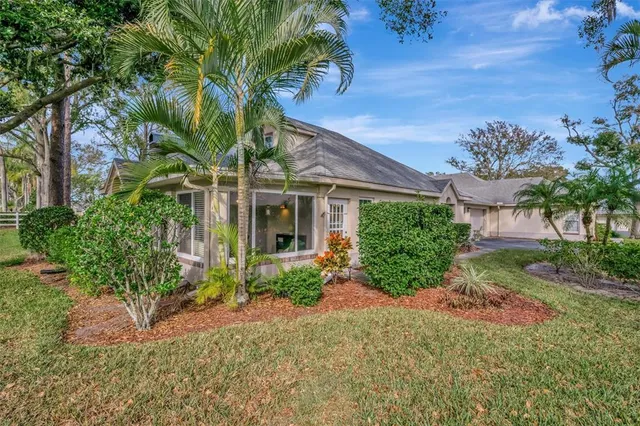 a living room with furniture and a dining table