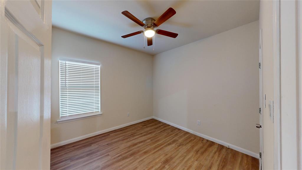 18636 Doubletree Drive Justin, TX 76247 - Photo 15 of 35 wooden floor in an empty room with a window