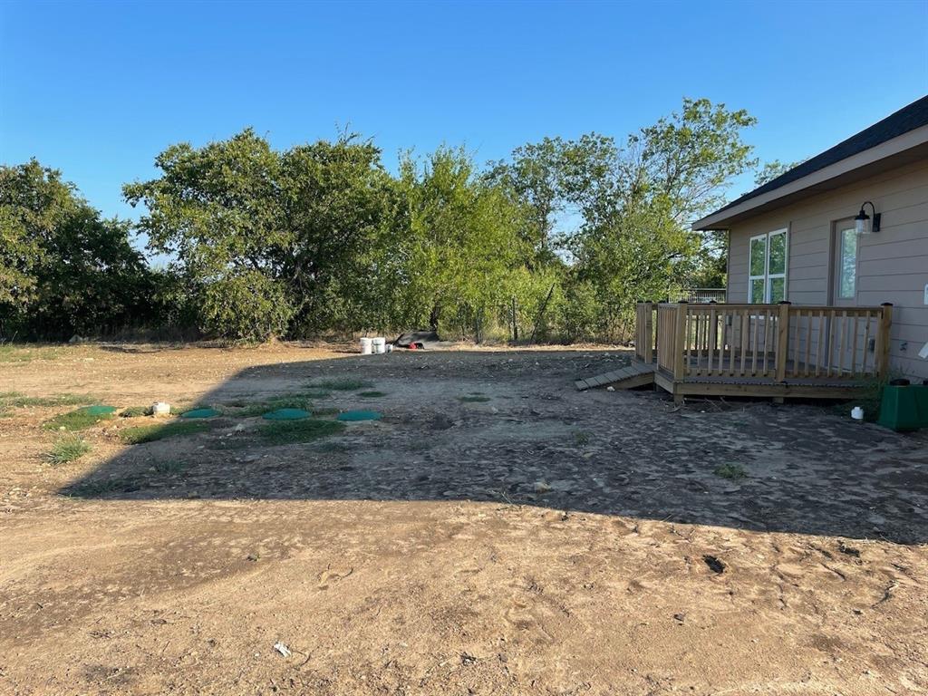 18636 Doubletree Drive Justin, TX 76247 - Photo 22 of 35 a view of a house with a yard