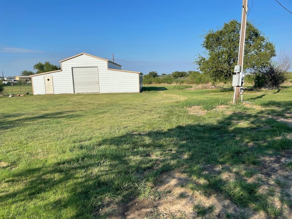 18636 Doubletree Drive Justin, TX 76247 - Photo 25 of 35 a white house with a yard