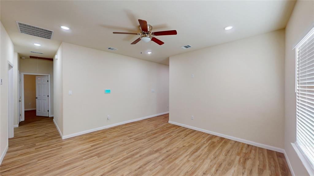 18636 Doubletree Drive Justin, TX 76247 - Photo 6 of 35 wooden floor in an empty room with a window