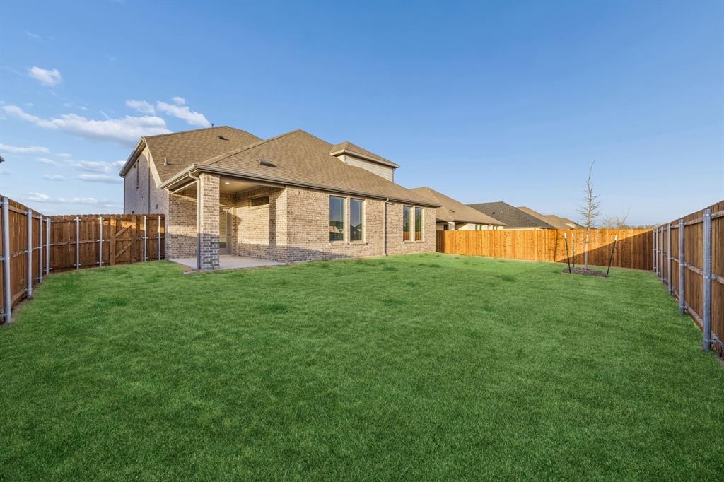 1404 Companero Street Haslet, TX 76052 - Photo 39 of 40 Covered Patio in the Wimbledon home plan by Trophy Signature Homes – REPRESENTATIVE PHOTO