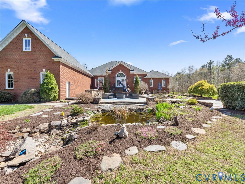 24200 Pear Orchard Road Moseley, VA 23120 - Photo 12 of 66 Rear view of property, koi pond and large blue sto