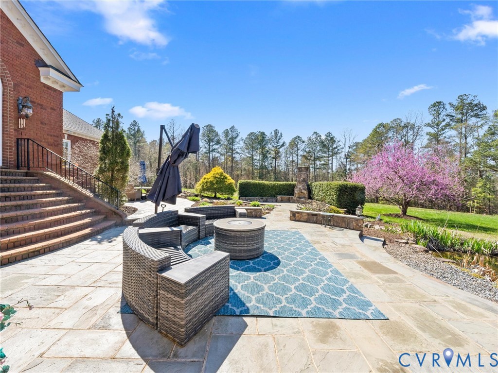 24200 Pear Orchard Road Moseley, VA 23120 - Photo 17 of 66 Large blue stone patio with outdoor kitchen