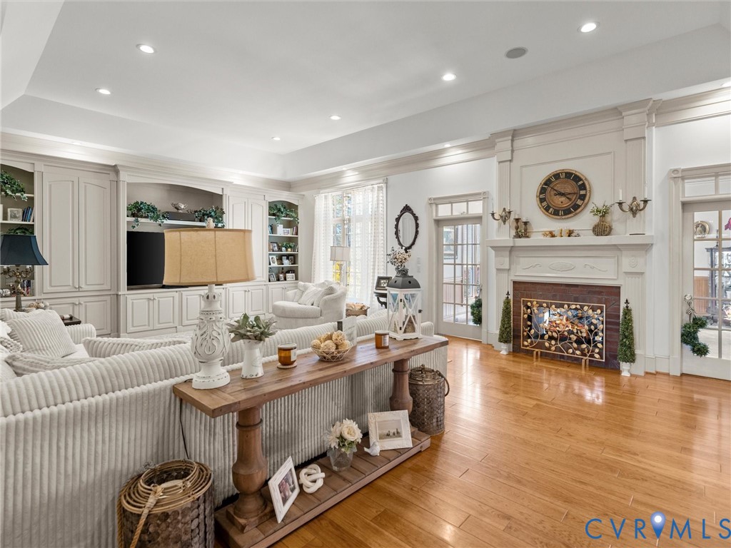 24200 Pear Orchard Road Moseley, VA 23120 - Photo 23 of 66 a living room with furniture and a fireplace
