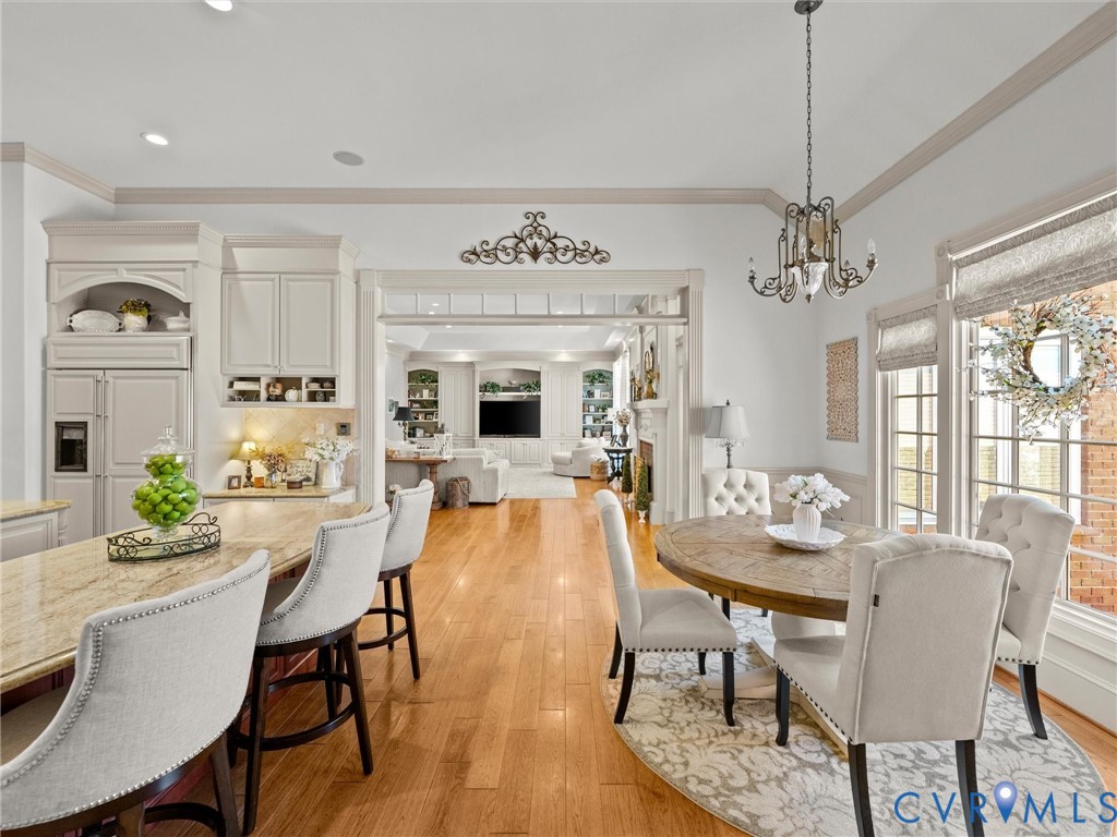 24200 Pear Orchard Road Moseley, VA 23120 - Photo 35 of 66 a view of a dining room with furniture window and wooden floor