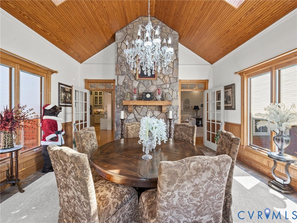 24200 Pear Orchard Road Moseley, VA 23120 - Photo 39 of 66 Vaulted wood ceiling with double sided fireplace