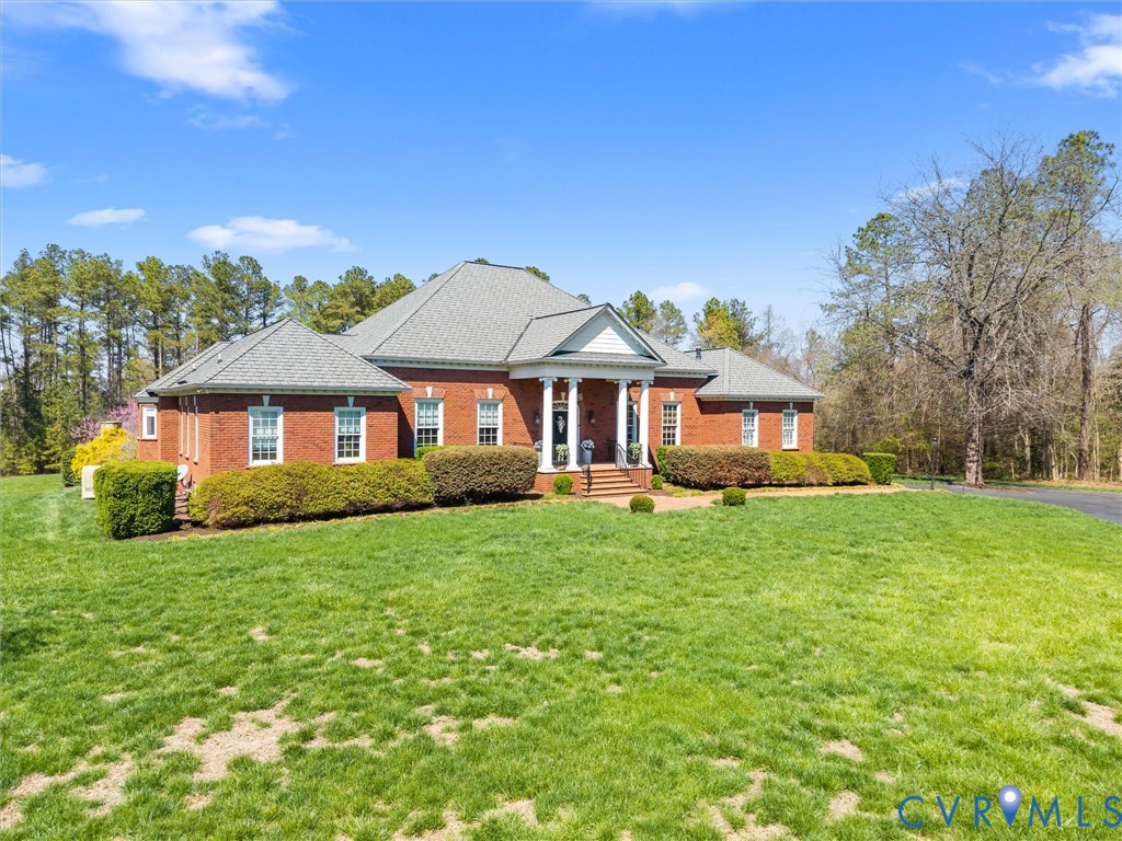 24200 Pear Orchard Road Moseley, VA 23120 - Photo 4 of 66 a front view of a house with a yard
