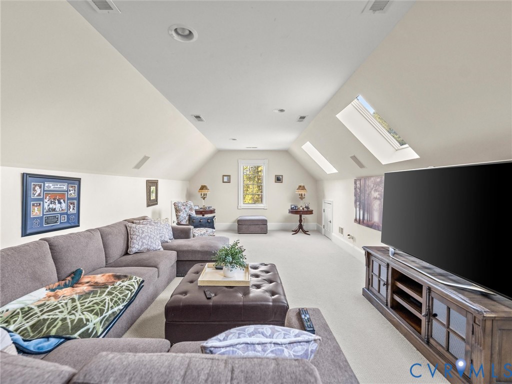 24200 Pear Orchard Road Moseley, VA 23120 - Photo 60 of 66 a living room with furniture and a flat screen tv