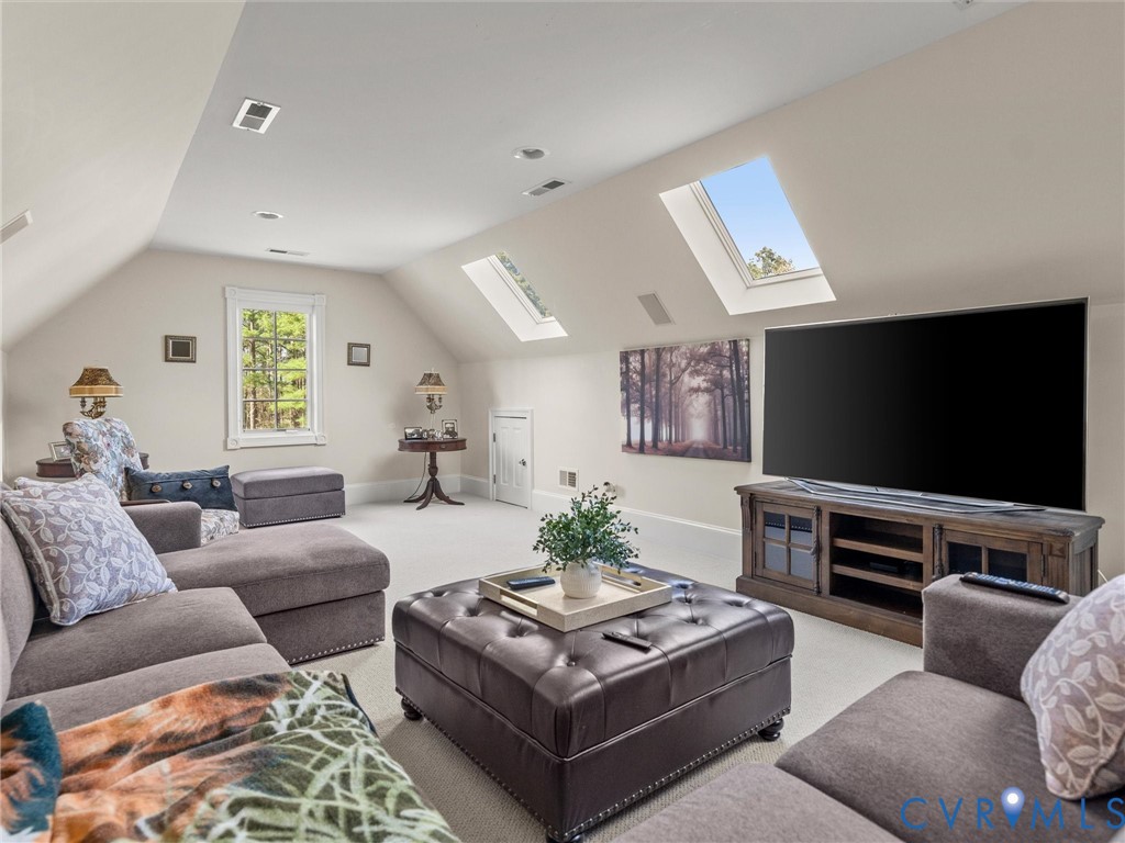 24200 Pear Orchard Road Moseley, VA 23120 - Photo 61 of 66 a living room with furniture and a flat screen tv