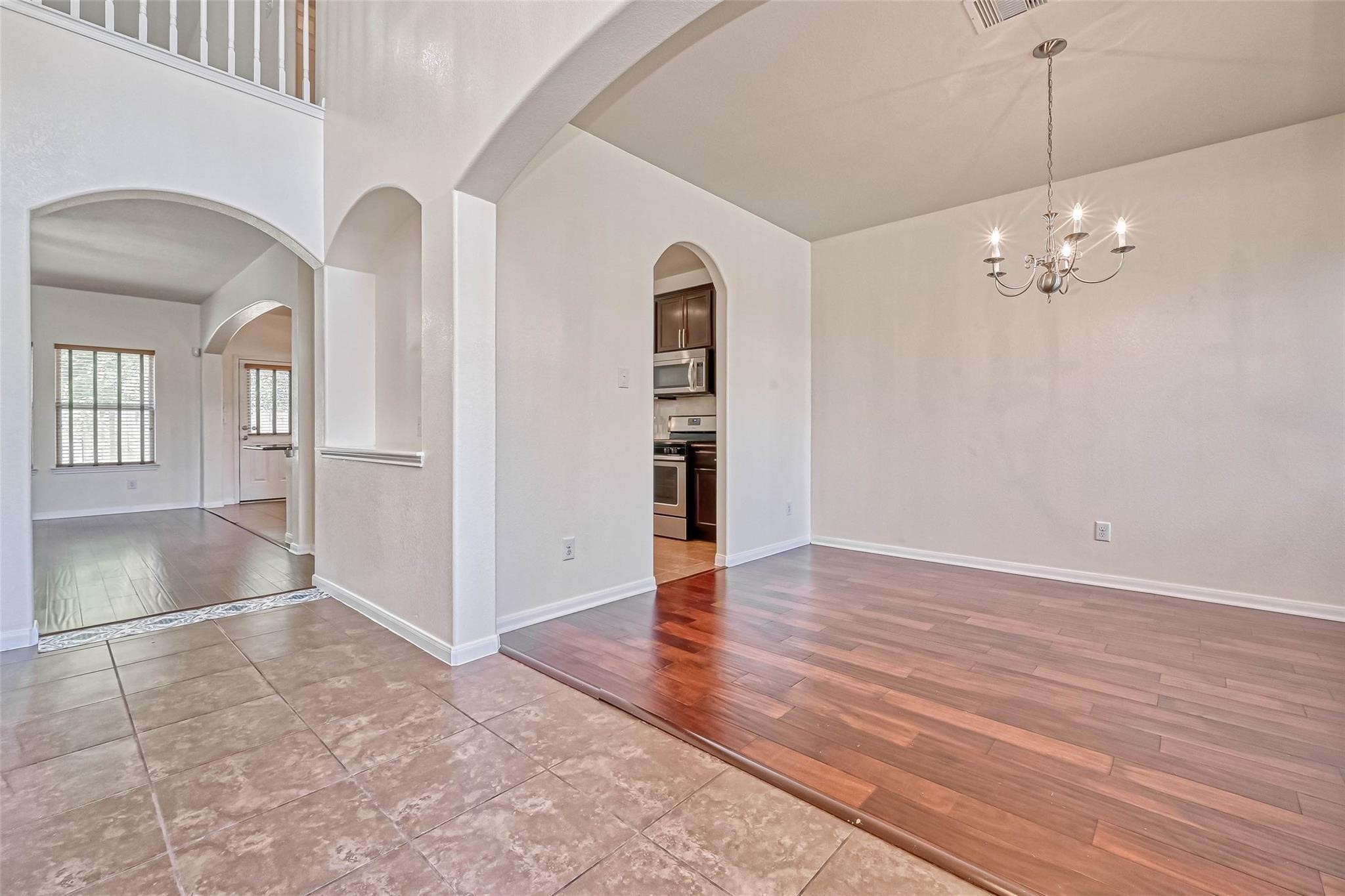 20555 Bonds Creek Lane Spring, TX 77388 - Photo 13 of 36 wooden floor in an empty room with a window