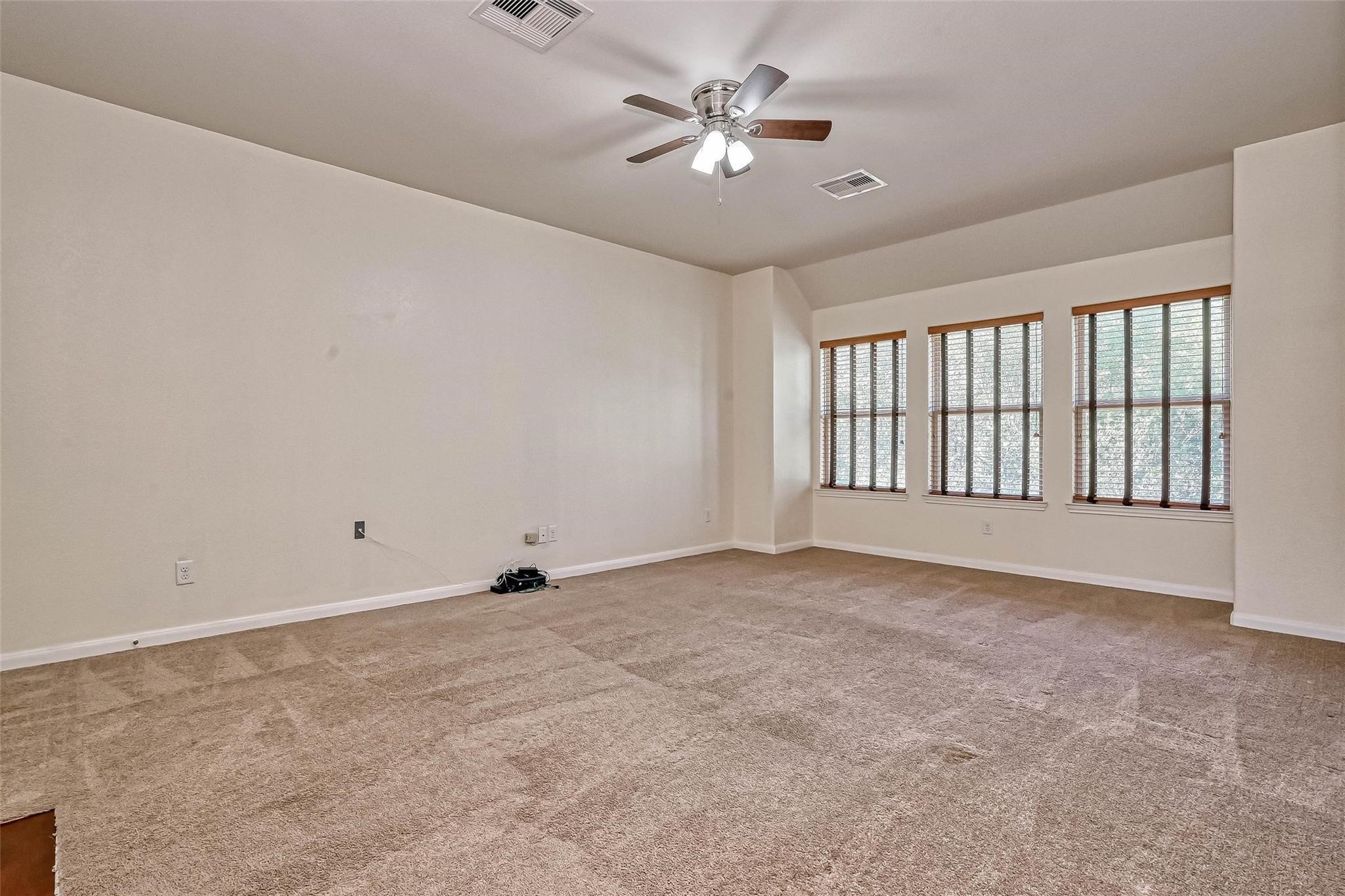 20555 Bonds Creek Lane Spring, TX 77388 - Photo 17 of 36 a view of an empty room with a window