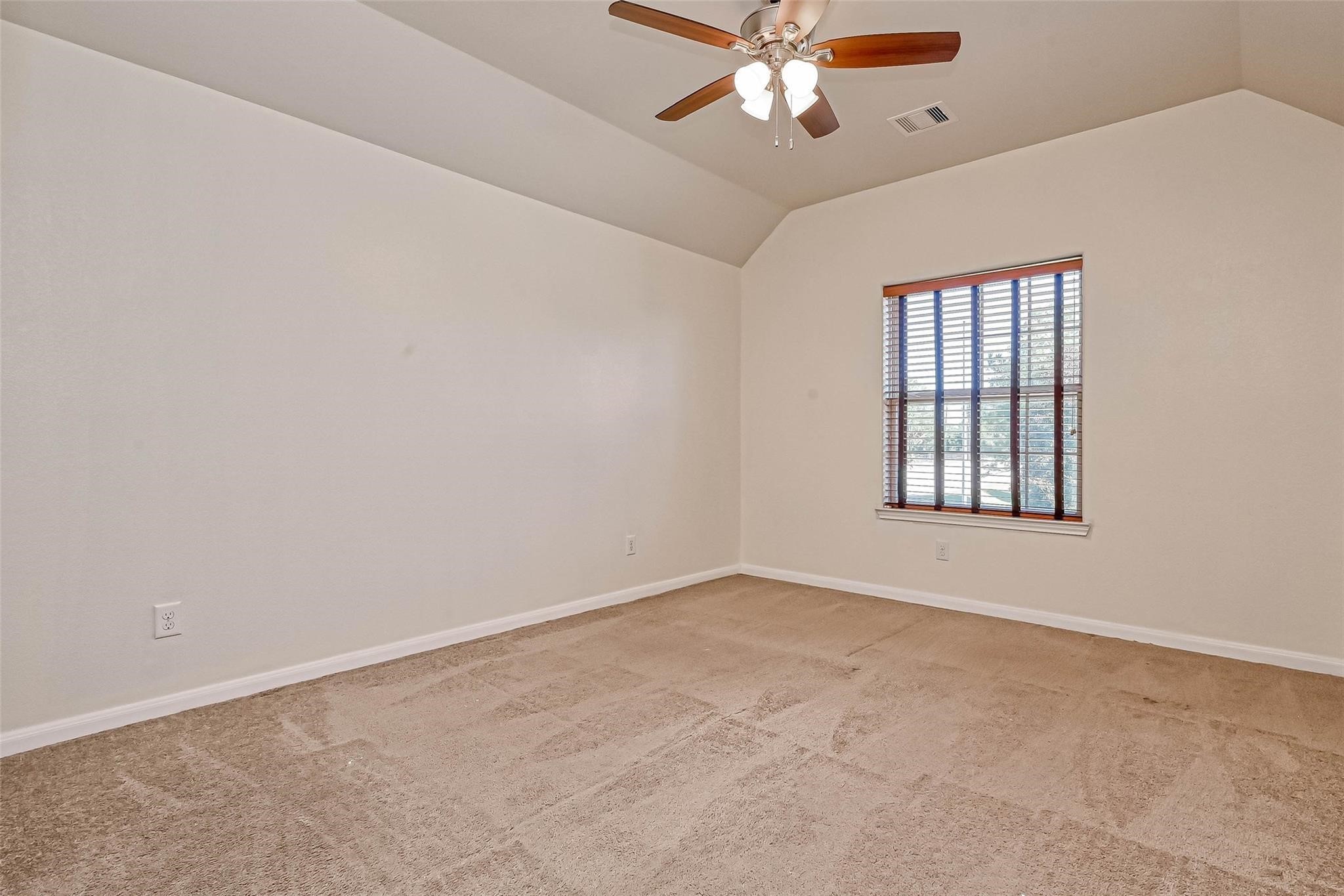 20555 Bonds Creek Lane Spring, TX 77388 - Photo 19 of 36 a view of an empty room with a window