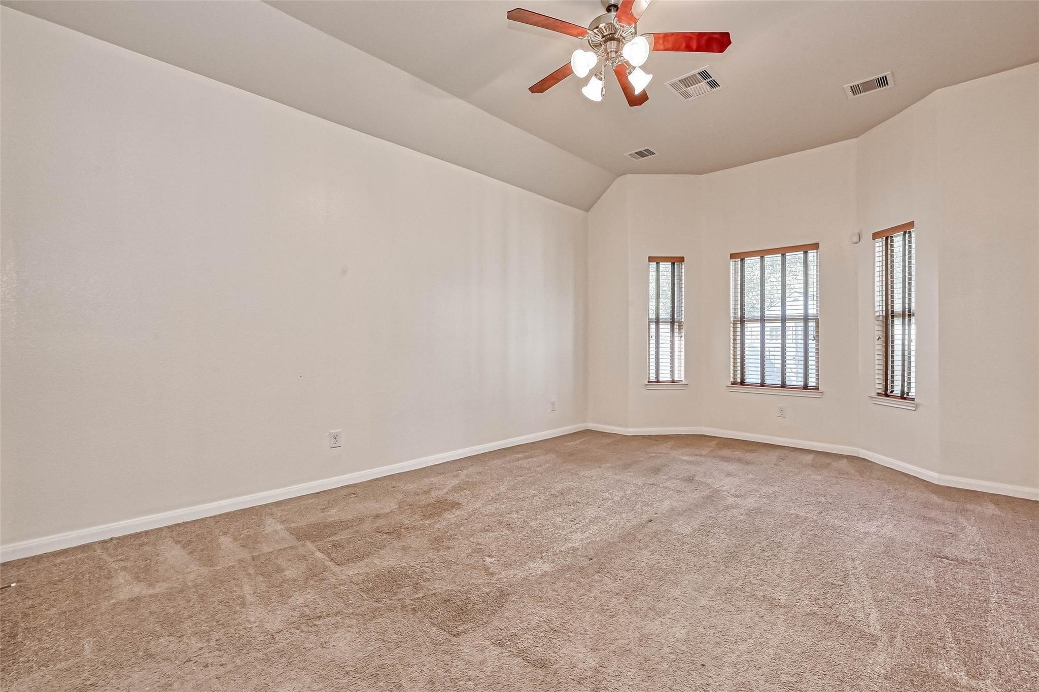 20555 Bonds Creek Lane Spring, TX 77388 - Photo 20 of 36 a view of an empty room with a window