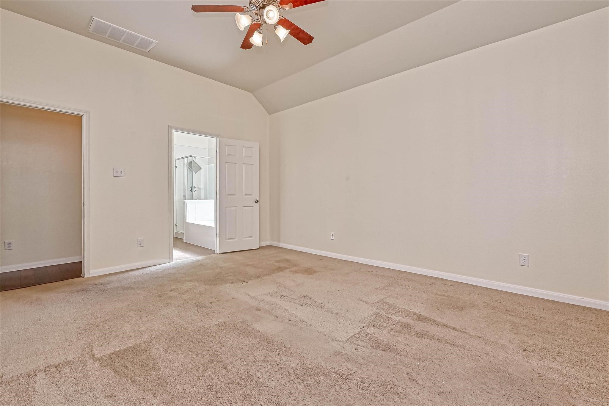 20555 Bonds Creek Lane Spring, TX 77388 - Photo 21 of 36 a view of an empty room with a chandelier fan