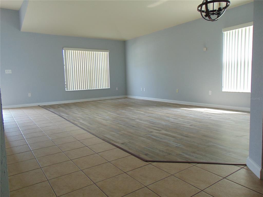 2946 Conner Lane Kissimmee, FL 34741 - Photo 12 of 13 an empty room with windows