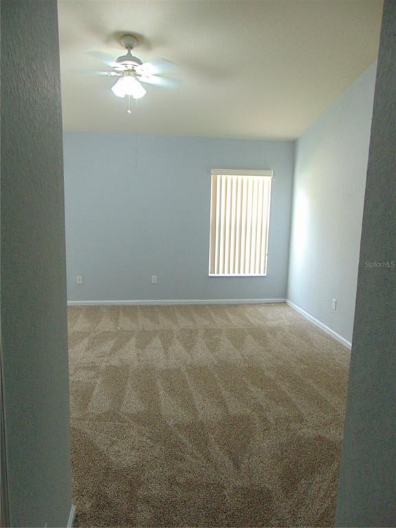 2946 Conner Lane Kissimmee, FL 34741 - Photo 9 of 13 a view of empty room with windows