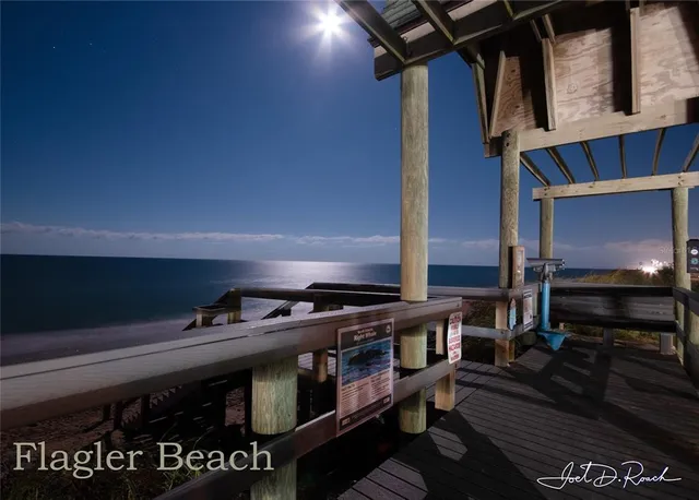 a view of an chairs and table in the room