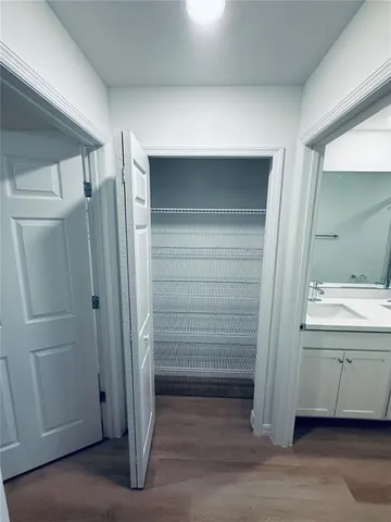 a bathroom with a shower and a sink