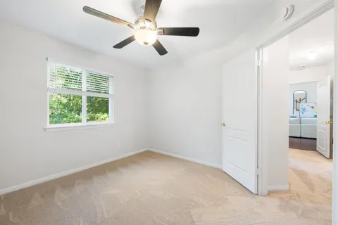 a spacious bathroom with a double vanity sink and a mirror