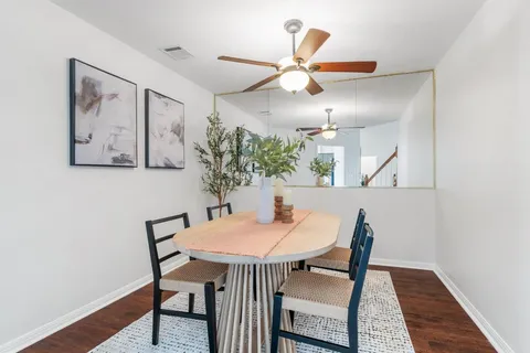 a dining room with furniture and window
