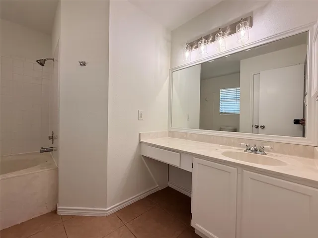 a bathroom with a sink a vanity and a mirror