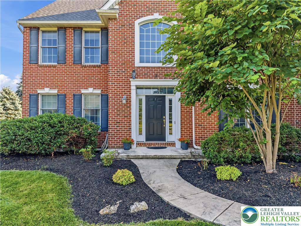 13 Country Road Northampton, PA 18067 - Photo 13 of 71 A classic brick facade welcomes with a stately entryway and meticulously maintained landscaping.