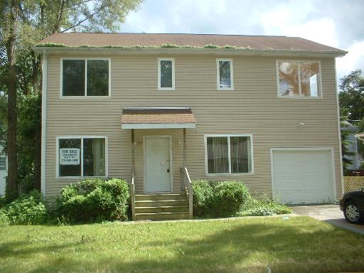 front view of a house and a yard