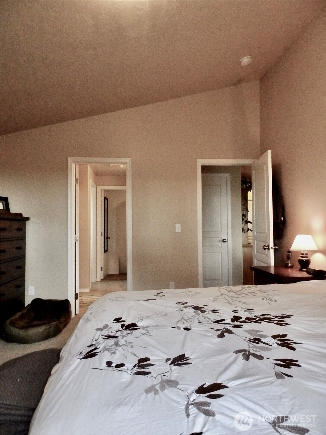 304 Southwest Homestead Avenue College Place, WA 99324 - Photo 17 of 21 a bedroom with a bed and a mirror